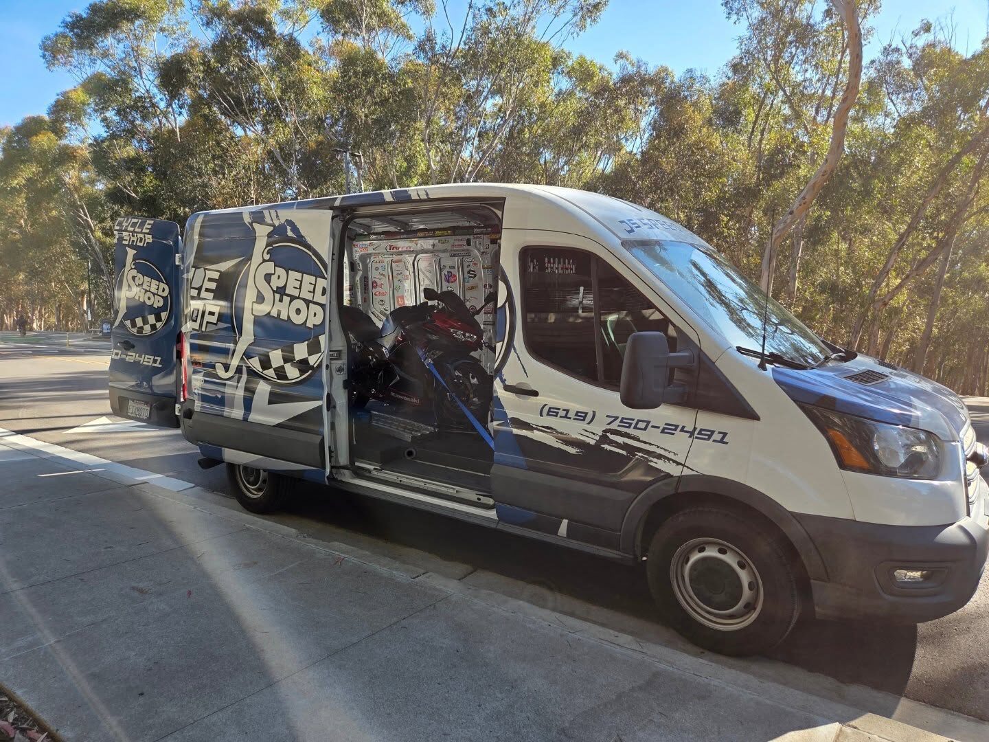 J's Speed Shop van loaded with a Kawasaki for delivery